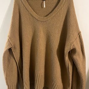 Free People Deep V Neck sweater! Can be worn Off one shoulder Size M